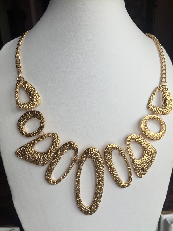 Gold toned multi shaped beautiful chic necklace
