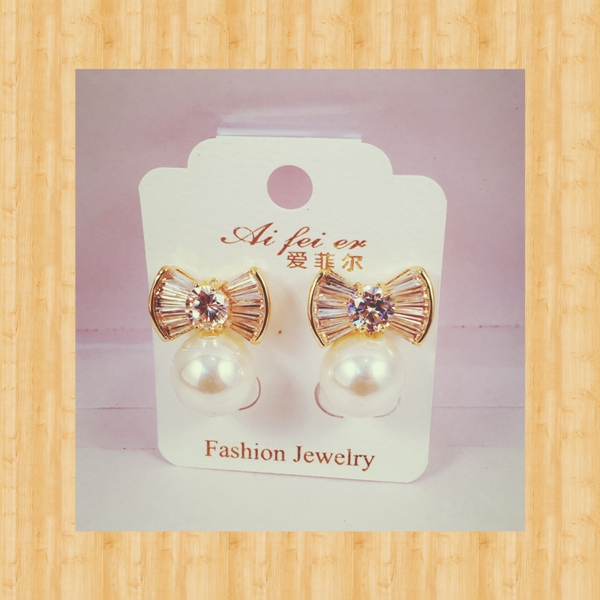 Crsytal bow and pearl earrings