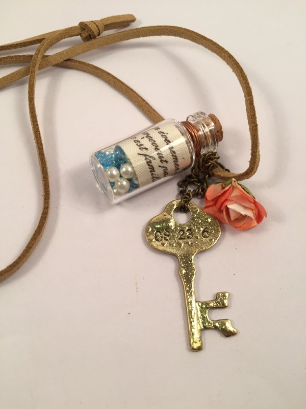 Stylish long chain with bottle- flower and key pendant